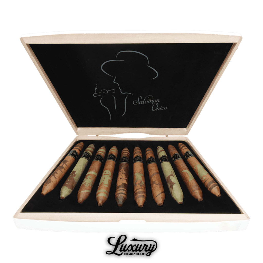 Open box of La Flor Dominicana Salomon Unico Limited Edition cigars showcasing various artistic wrapper patterns, each uniquely crafted, presented by Luxury Cigar Club.