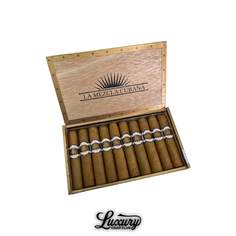 Open wooden box of La Mezcla Cubana Rothschild cigars displaying twelve Connecticut-wrapped cigars with elegant brown and gold bands. Luxury Cigar Club logo shown beneath.