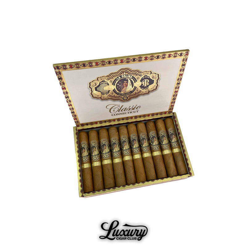 Open decorative box of La Palina Classic Connecticut Robusto cigars featuring elegant gold and cream interior artwork with the La Palina logo and “Classic Connecticut” branding. Cigars neatly arranged in two rows. Luxury Cigar Club logo shown below.