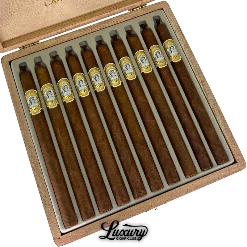 Close-up of La Palina Goldie Laguito No. 1 box showing detailed gold-embossed bands and artisanal presentation – Luxury Cigar Club.