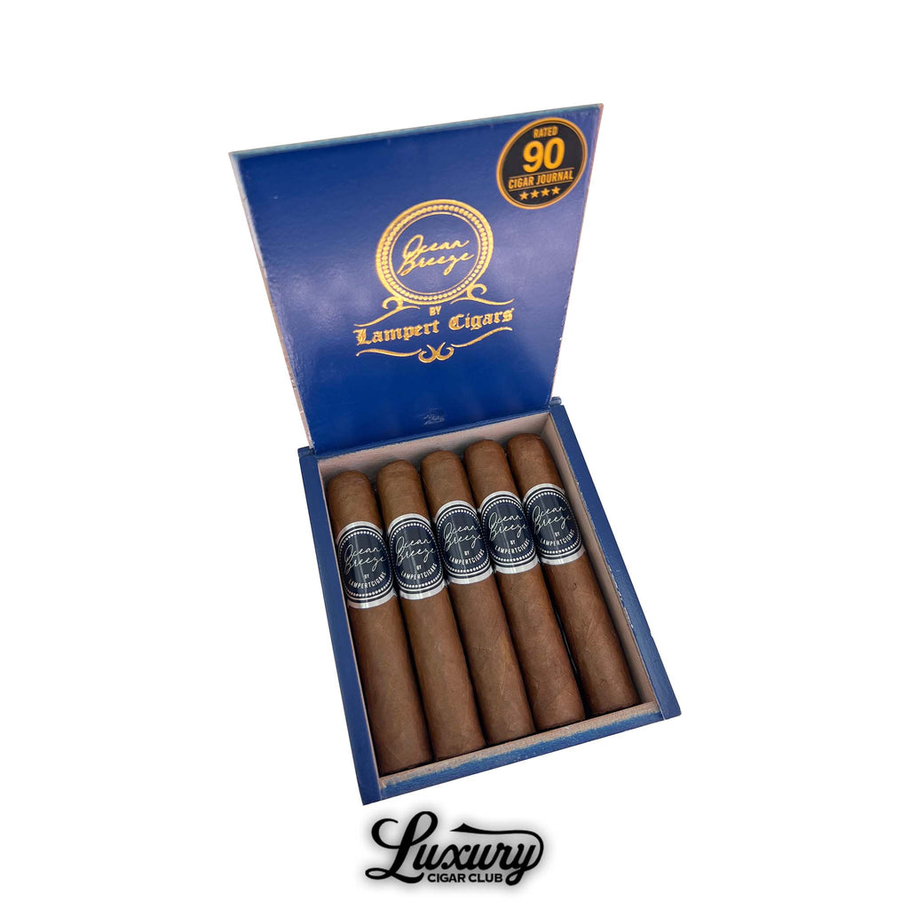 Lampert Ocean Breeze Robusto Grande cigars displayed in an open blue box with gold detailing, available at Luxury Cigar Club.