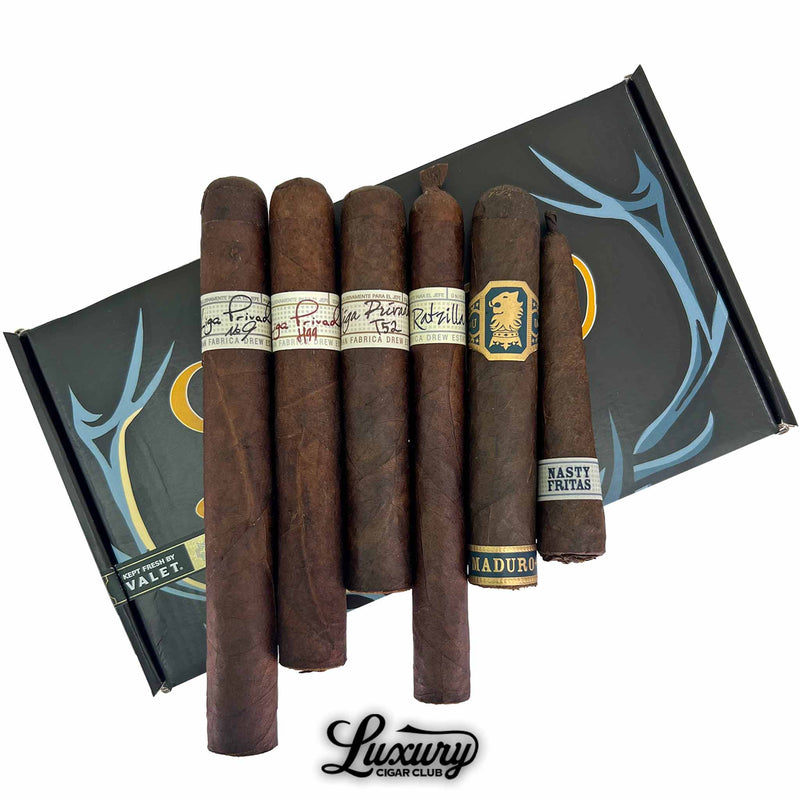 Close-up of Liga Privada 7th Anniversary Sampler featuring Liga Privada No. 9, T52, Undercrown, and Papas Fritas cigars from Drew Estate, presented by Luxury Cigar Club.