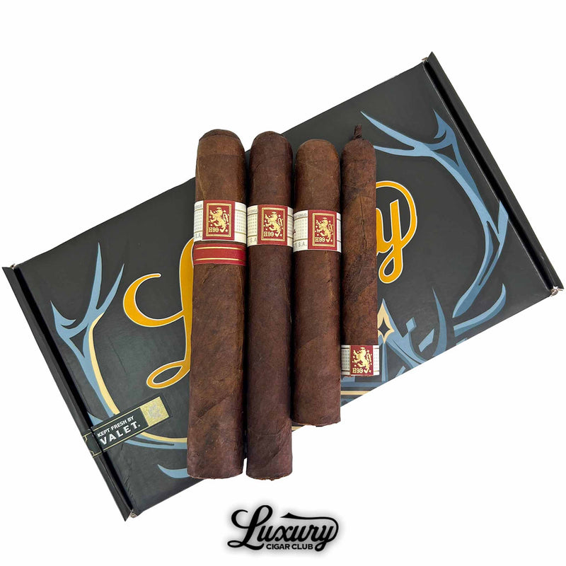 Liga Privada Black Friday 2025 Freebie Sampler No 1 cigars displayed on a Luxury Cigar Club Valet box featuring four H99 and T52 cigars in varying sizes.