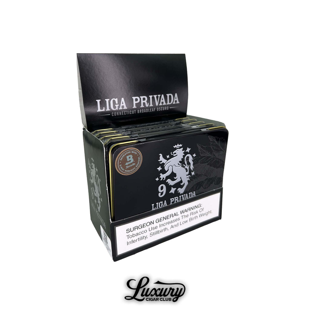 Display box of Drew Estate Liga Privada No. 9 Coronets cigar tins with black embossed tin design, Boveda humidity seal, and Luxury Cigar Club logo