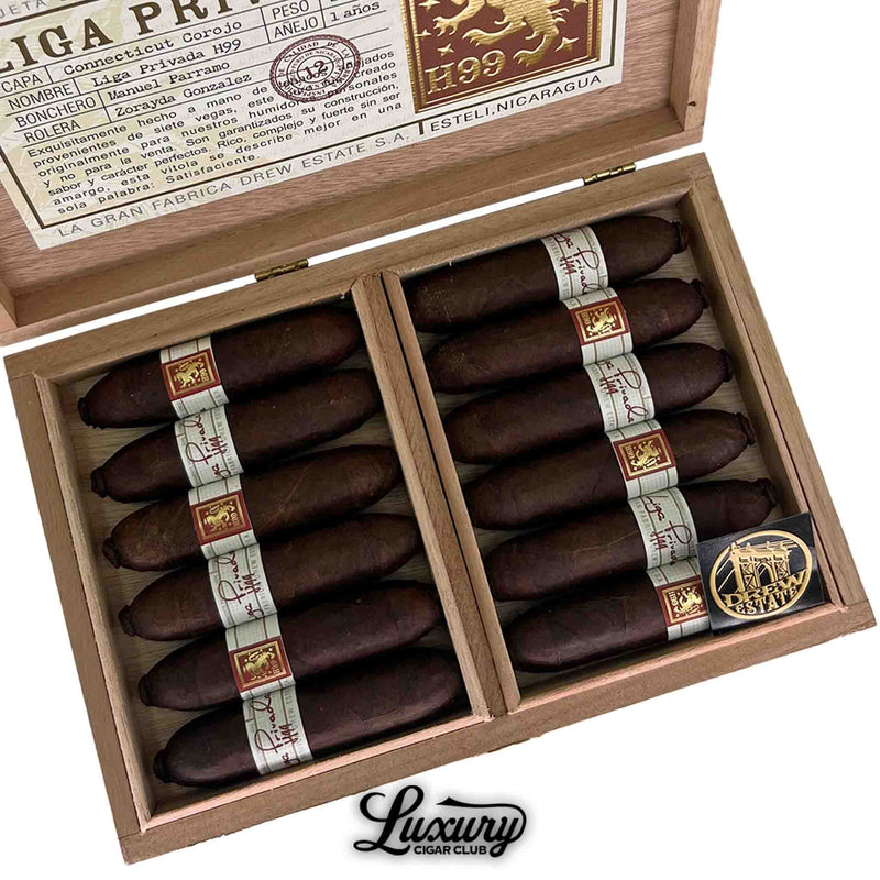 Close-up view of Liga Privada H99 Flying Pig cigars highlighting dark brown wrapper and detailed band design.