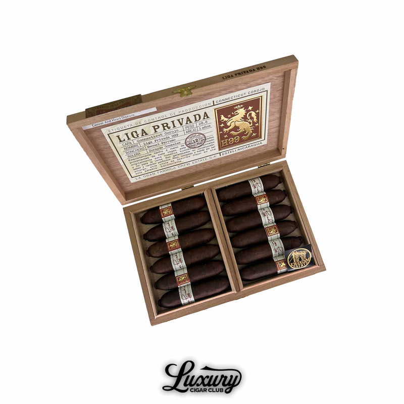 Open box of Liga Privada H99 Flying Pig cigars with Connecticut Corojo wrapper, displayed in two rows inside a wooden box.