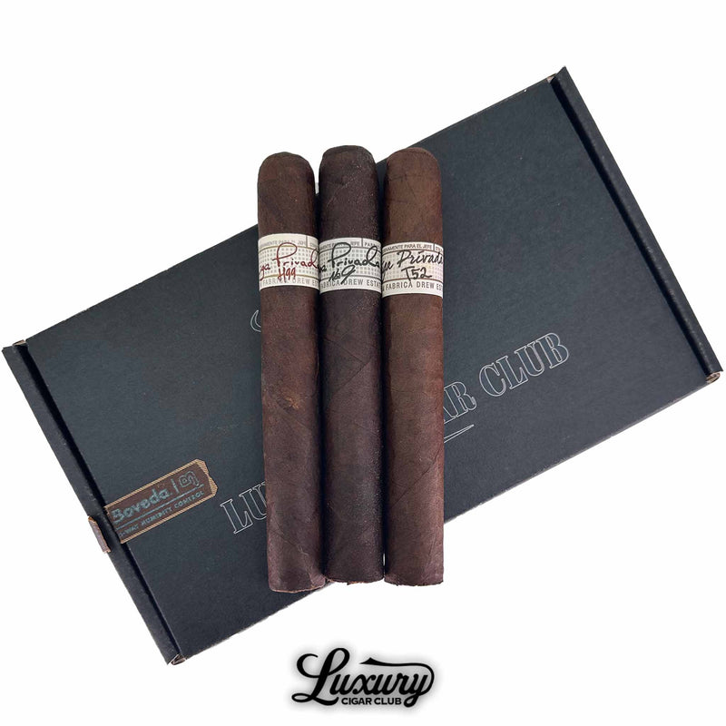 Close-up of Liga Privada Toro cigar sampler highlighting rich dark wrappers and detailed cigar bands, displayed by Luxury Cigar Club.