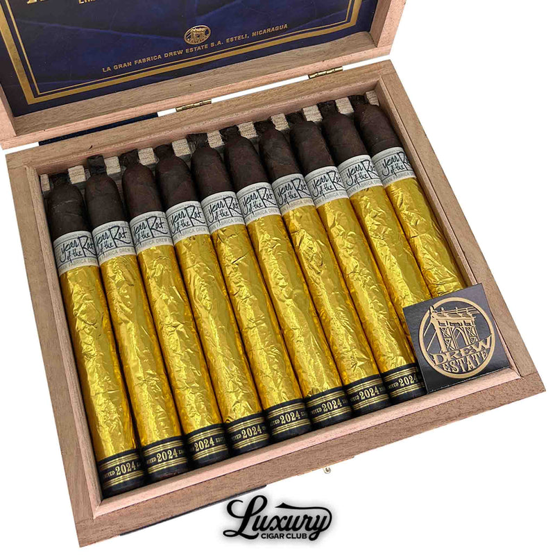 Close-up of Liga Privada Único Serie Year of the Rat cigars showing detailed gold foil wrapping and Drew Estate branding, presented by Luxury Cigar Club.