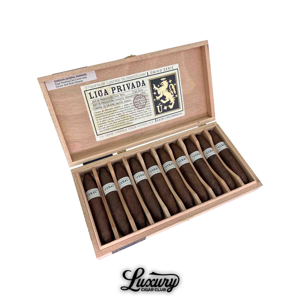 A wooden box of Liga Privada Unico Series Feral Flying Pig cigars by Drew Estate, showcasing 12 short, fat perfecto cigars with dark brown wrappers and silver bands, arranged neatly with individual wooden dividers, available at Luxury Cigar Club.