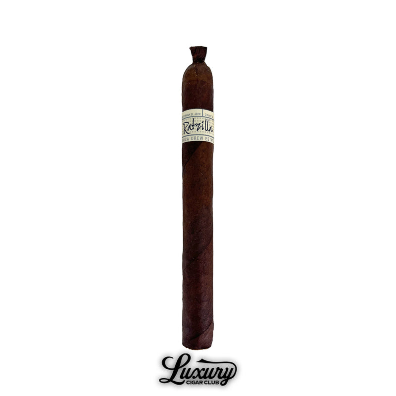 Single Liga Privada Único Series Ratzilla cigar featuring a sleek, dark wrapper, pigtail cap, and white handwritten-style band, displayed with Luxury Cigar Club branding.