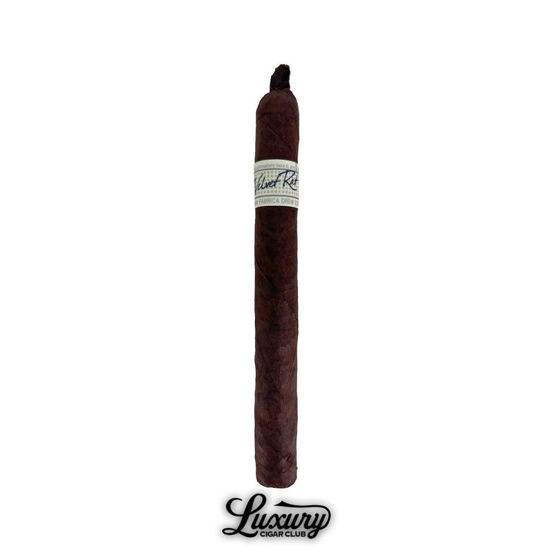 Single Liga Privada Unico Series Velvet Rat cigar with a dark wrapper and white band, displayed on a white background from Luxury Cigar Club.