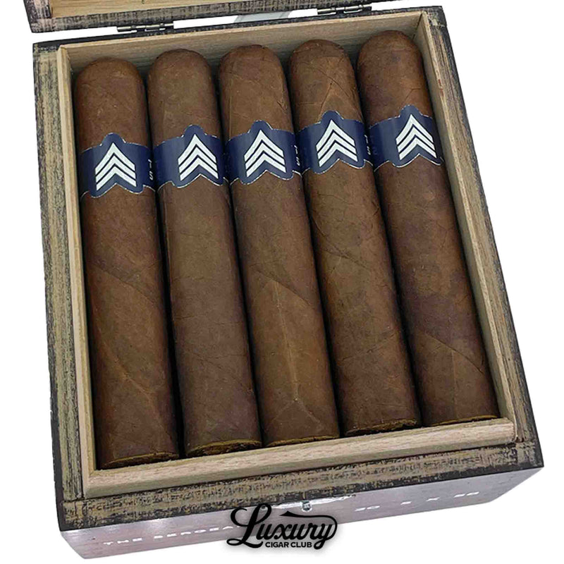Close-up of Luciano The Sergeant Robusto Gordo cigars neatly arranged in a rustic wooden box with distinctive blue and white chevron bands, Luxury Cigar Club exclusive.