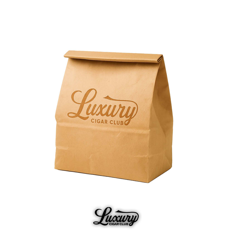 Luxury Cigar Club brown paper bag sampler featuring the brand's logo printed in elegant script on the front. The bag is folded at the top and stands upright against a clean white background.