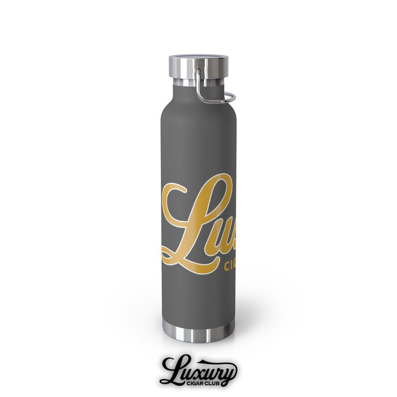 Luxury Cigar Club copper vacuum insulated 22oz bottle in matte grey with gold logo angled view