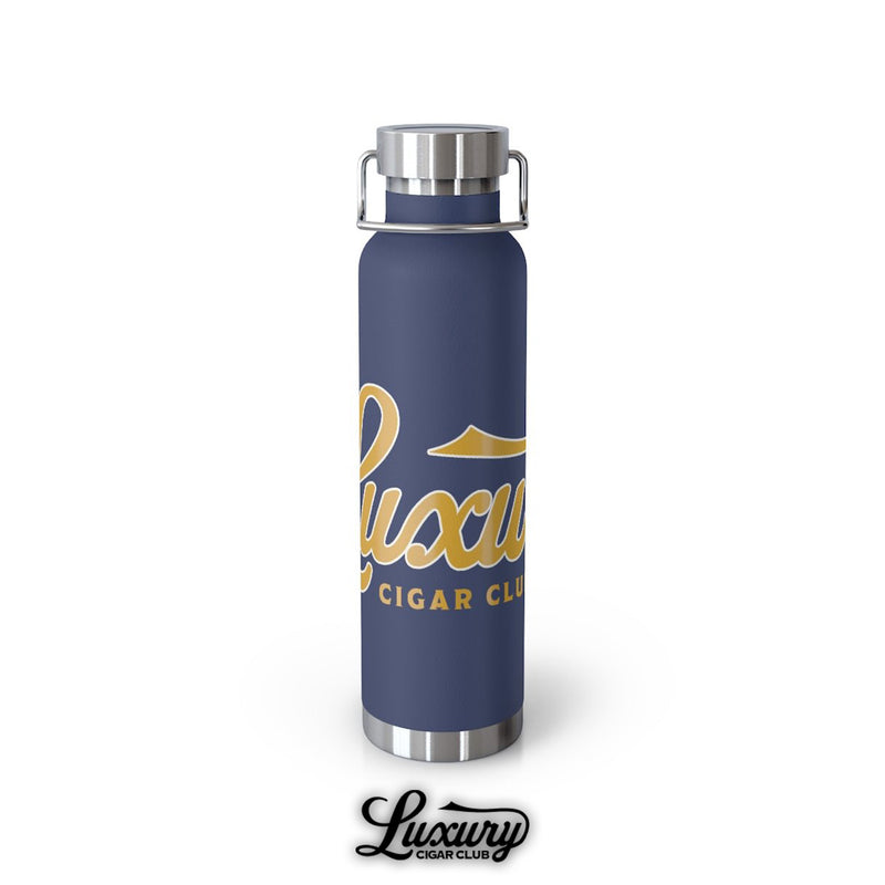 Luxury Cigar Club copper vacuum 22oz insulated bottle in navy blue with gold logo standing upright against white background