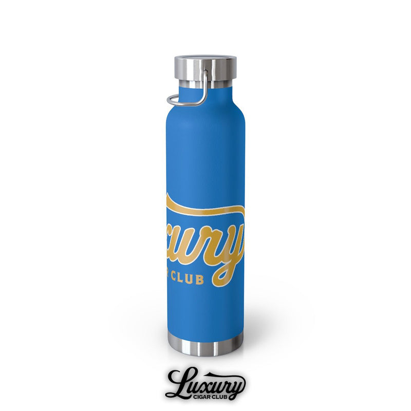 Luxury Cigar Club copper vacuum insulated bottle in pebble blue showing curved script logo wrapping around the matte finished body