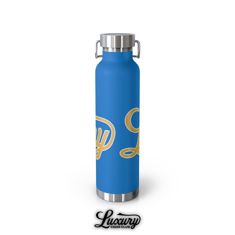 Back angle of pebble blue Luxury Cigar Club insulated 22oz bottle with stainless steel bottom and partial gold lettering detail