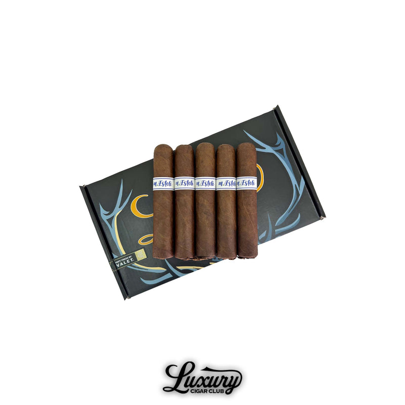 MBombay M.Esteli Robusto cigars displayed on a sleek black and blue box with elegant branding, presented by Luxury Cigar Club.