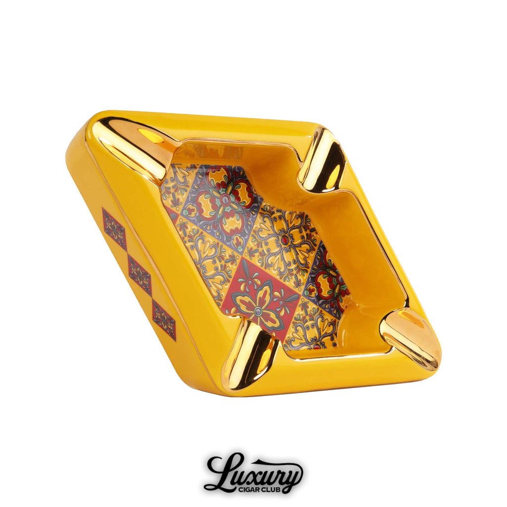 Manny Iriarte Opus X Society Colonial Tiles Yellow Ashtray with gold trim and intricate red and blue tile design cigar accessory online