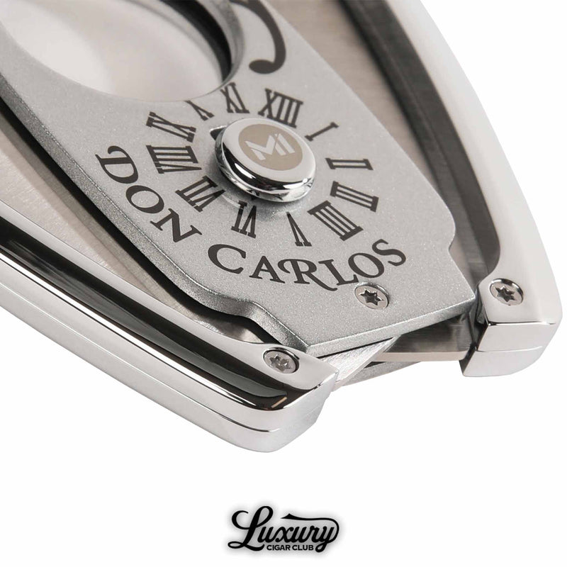 Close-up of Manny Iriarte Opus X Society Don Carlos Cutter showing detailed craftsmanship and brushed metal finish, photographed for Luxury Cigar Club.