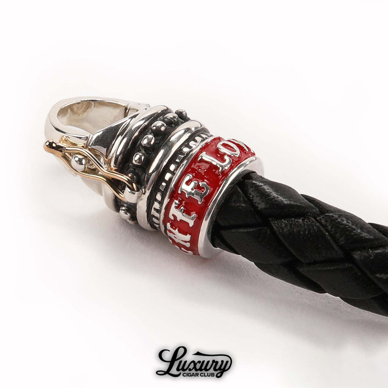 Close-up of clasp on Manny Iriarte Opus X Society black leather bracelet with red “Fuente Love” accents, cigar accessory at Luxury Cigar Club.