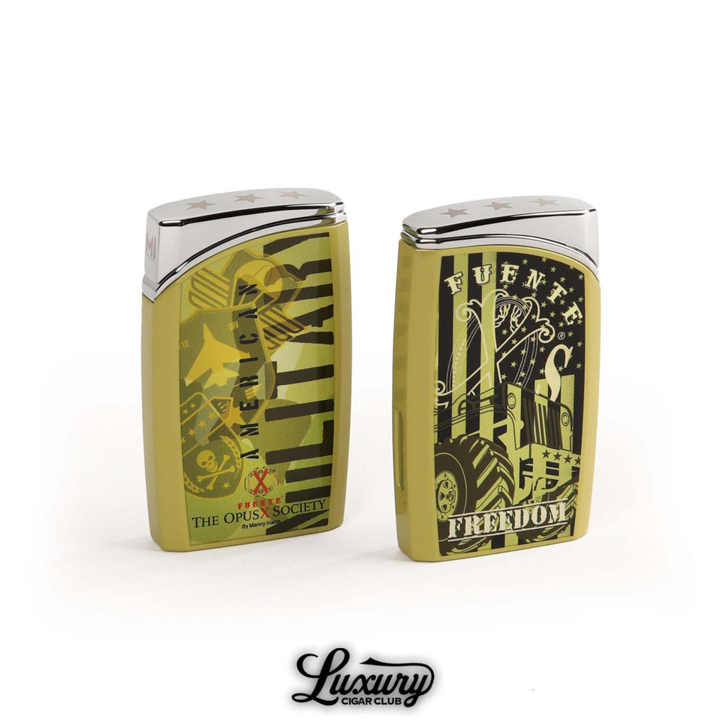 Manny Iriarte Opus X Society OXS Freedom J30 Lighter featuring bold olive green American-themed artwork with chrome accents, displayed by Luxury Cigar Club.