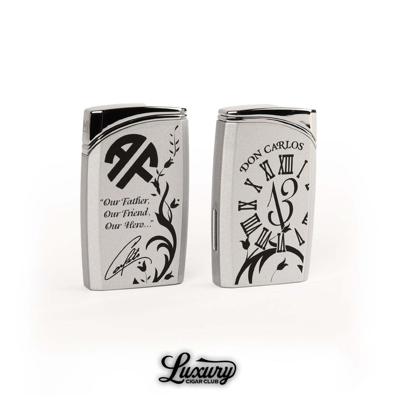 Manny Iriarte Opus X Society OXS Don Carlos J30 lighter in silver with black engraved Roman numerals and quote design honoring Don Carlos luxury cigar accessory