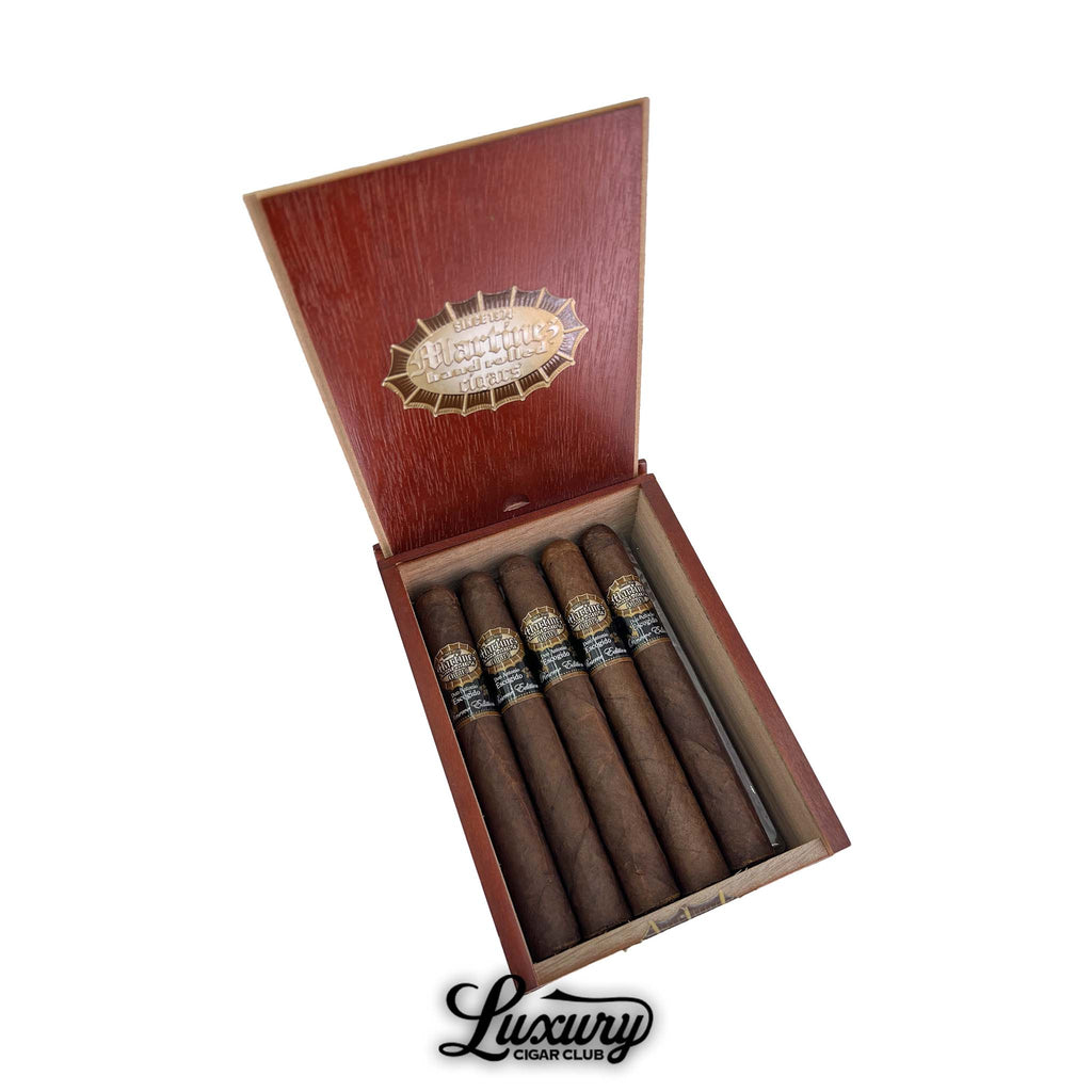 Open red wood box of Martinez Don Antonio Escogido MK II Maduro Toro cigars, showing five dark brown box-pressed toro cigars with black and gold bands arranged neatly in the box, with Luxury Cigar Club logo beneath.
