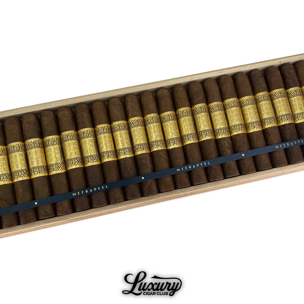 Meerapfel Master Blend Meir Limited Edition Robusto cigars arranged in a box with luxurious gold bands and dark wrappers, presented by Luxury Cigar Club.