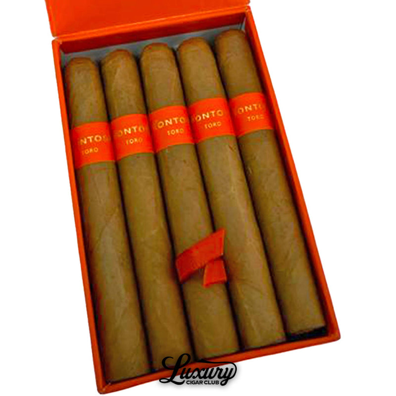 Close-up of Montosa Natural Toro cigars inside an orange box with matching orange bands labeled “Toro,” showcasing uniform craftsmanship, presented by Luxury Cigar Club.