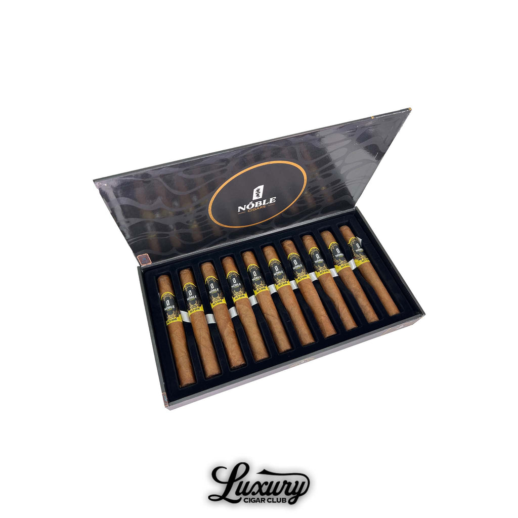 Open black Noble Cigars presentation box showing 10 Noble Act One Toro cigars arranged in a single row inside a black velvet style tray, lid open displaying the Noble logo, with the Luxury Cigar Club logo below.