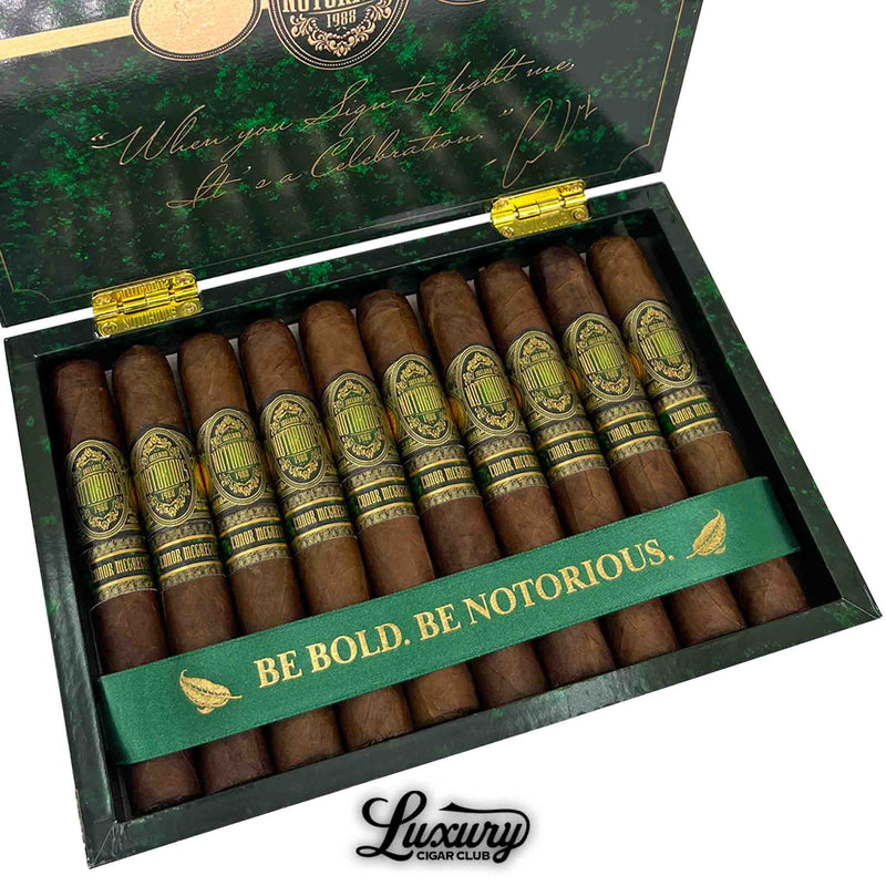 Detailed view of Notorious Conor McGregor Double Robusto cigars in a box with gold-embossed bands and green interior.