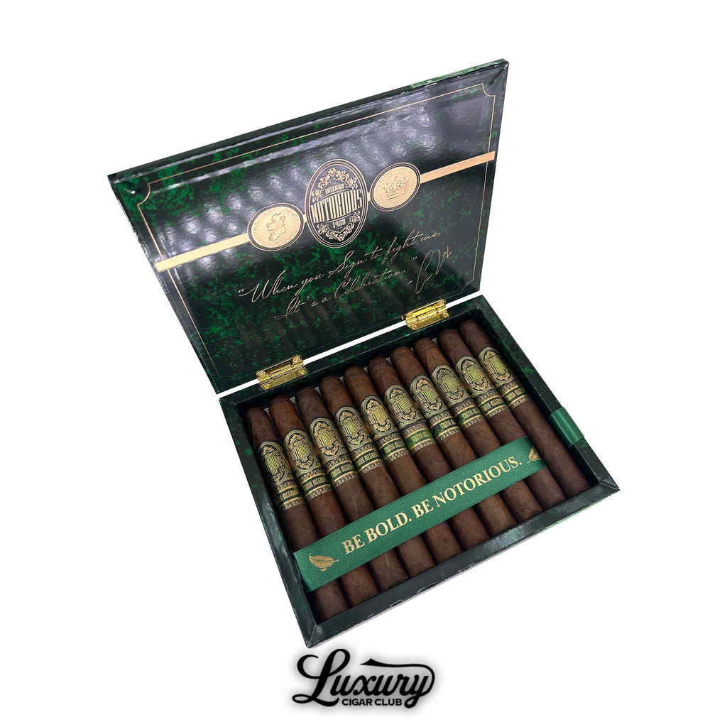 Open box of Notorious Conor McGregor Toro cigars featuring “Be Bold. Be Notorious.” ribbon and premium presentation.