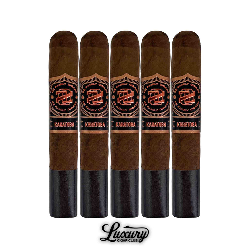 Five Ozgener Family Cigars Karatoba Robusto cigars standing upright in a row, each with a dark brown wrapper and bold black-and-copper band displaying the Karatoba branding, shown above the Luxury Cigar Club logo.