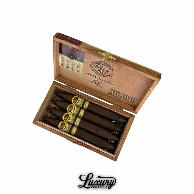 Open wooden box of Padron 1926 Serie 80 Years Maduro Perfecto cigars with gold and brown bands, displayed with the Luxury Cigar Club logo.