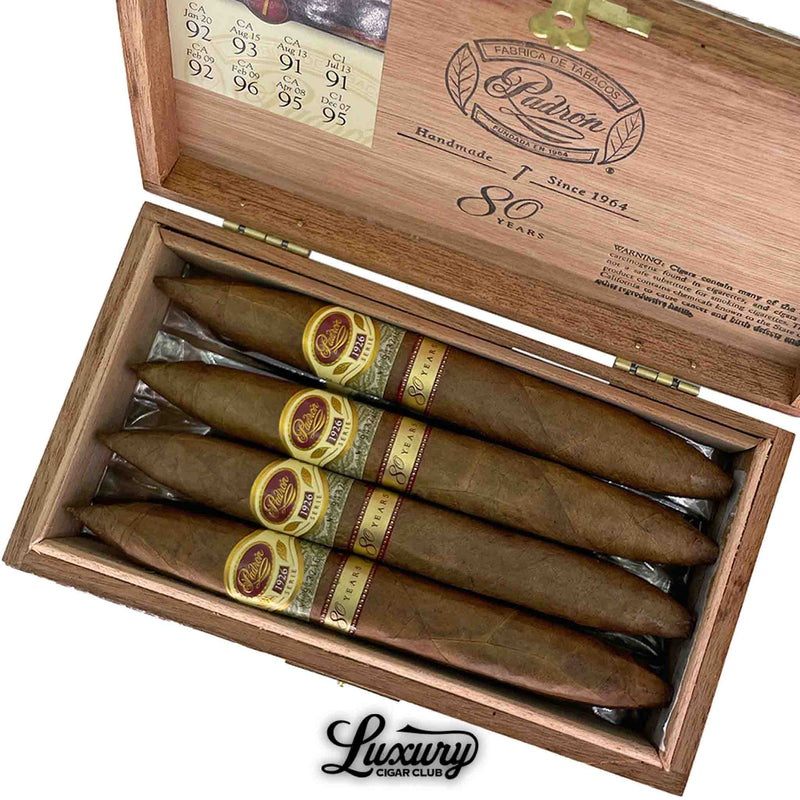 Close-up of Padron 1926 80 Year Natural Perfecto cigars highlighting premium craftsmanship and detailed band design, presented by Luxury Cigar Club.