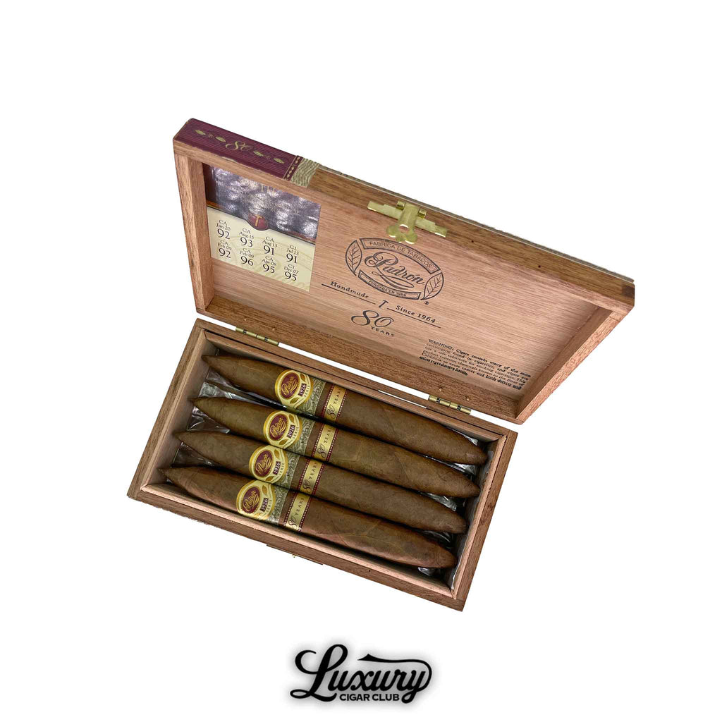 Padron 1926 80 Year Natural Perfecto cigars displayed in an elegant wooden box with gold accents, available at Luxury Cigar Club.