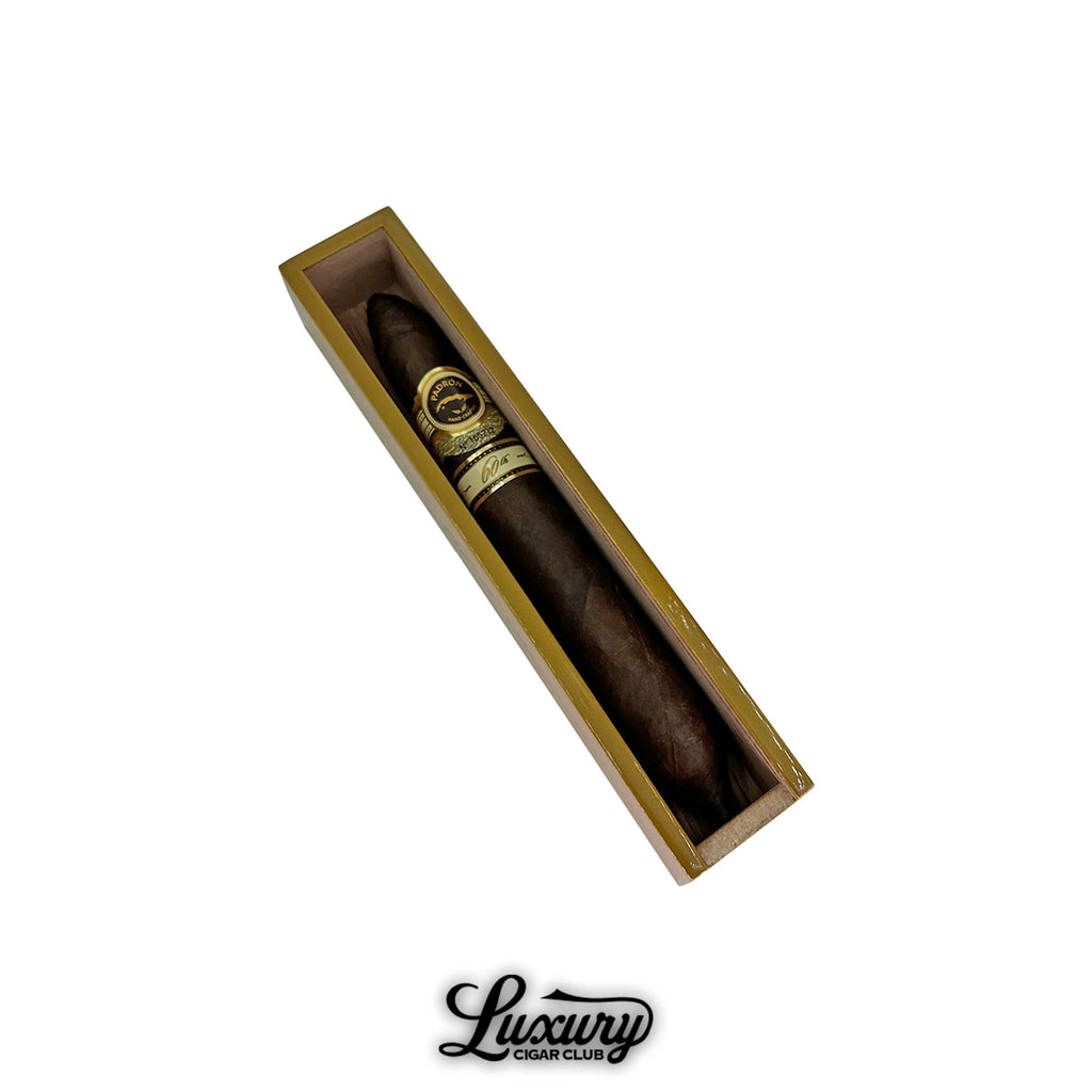 Padrón 60th Anniversary Maduro Double Perfecto cigar elegantly presented in an individual wooden box, showcasing its dark, oily Maduro wrapper and refined gold banding, featured by Luxury Cigar Club.