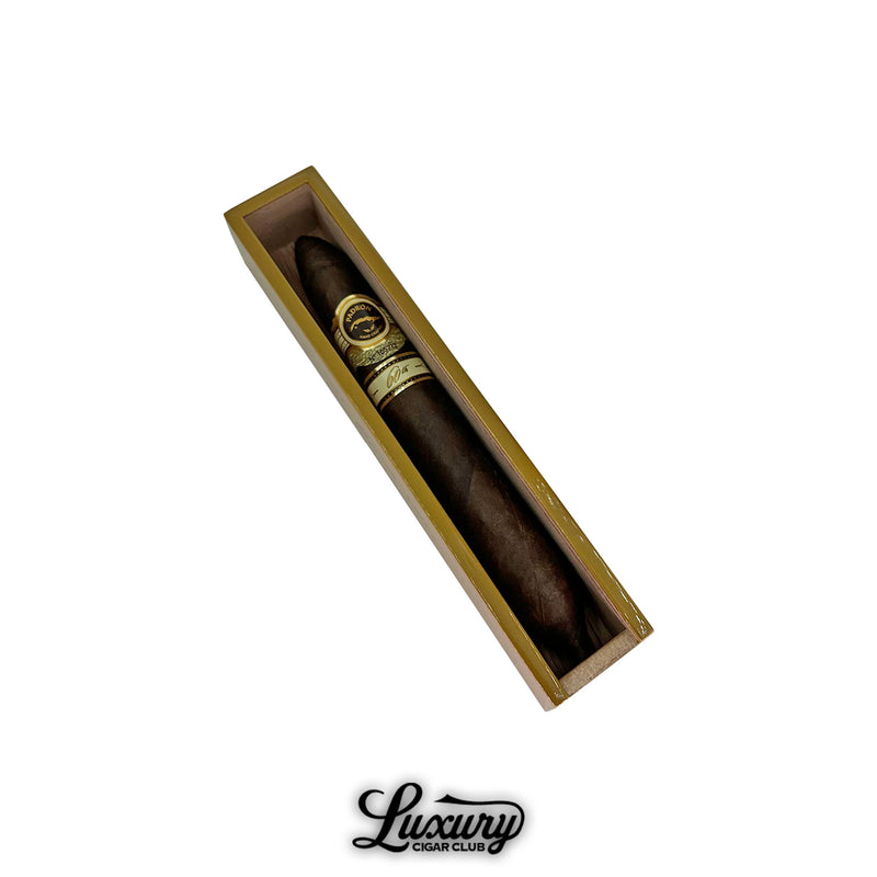 Padrón 60th Anniversary Maduro Double Perfecto cigar elegantly presented in an individual wooden box, showcasing its dark, oily Maduro wrapper and refined gold banding, featured by Luxury Cigar Club.