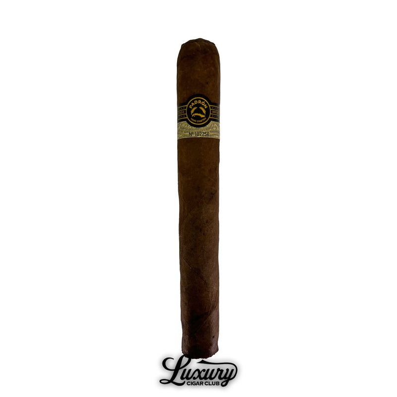 Single Padron Black Maduro Unicorn PB99 cigar standing upright with dark wrapper and gold-black band, Luxury Cigar Club logo below.