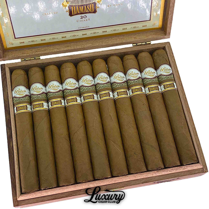 Close-up of Padrón Damaso Series No. 15 cigars showing the smooth golden wrappers, detailed dual-band design, and expert craftsmanship, featured by Luxury Cigar Club.