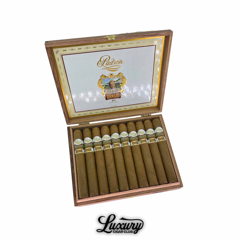 Padrón Damaso Series No. 15 cigars displayed in an open cedar box, featuring silky Connecticut-seed wrappers and elegant gold-accented bands, presented by Luxury Cigar Club.