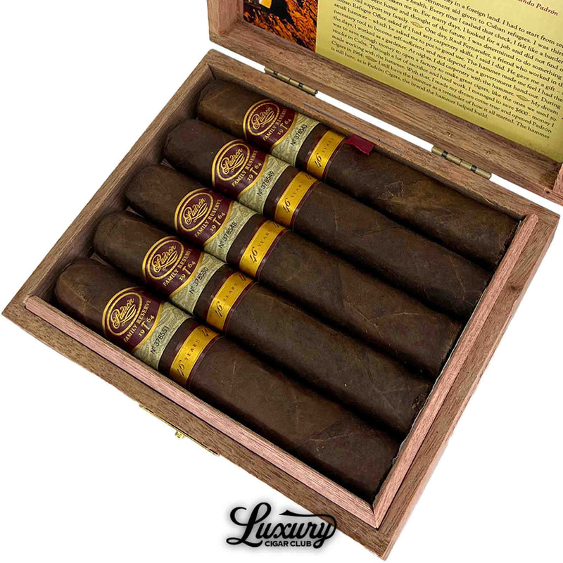 Close up of Padron Family Reserve Maduro No 46 cigars inside an open wooden box with detailed banding, sold at Luxury Cigar Club.