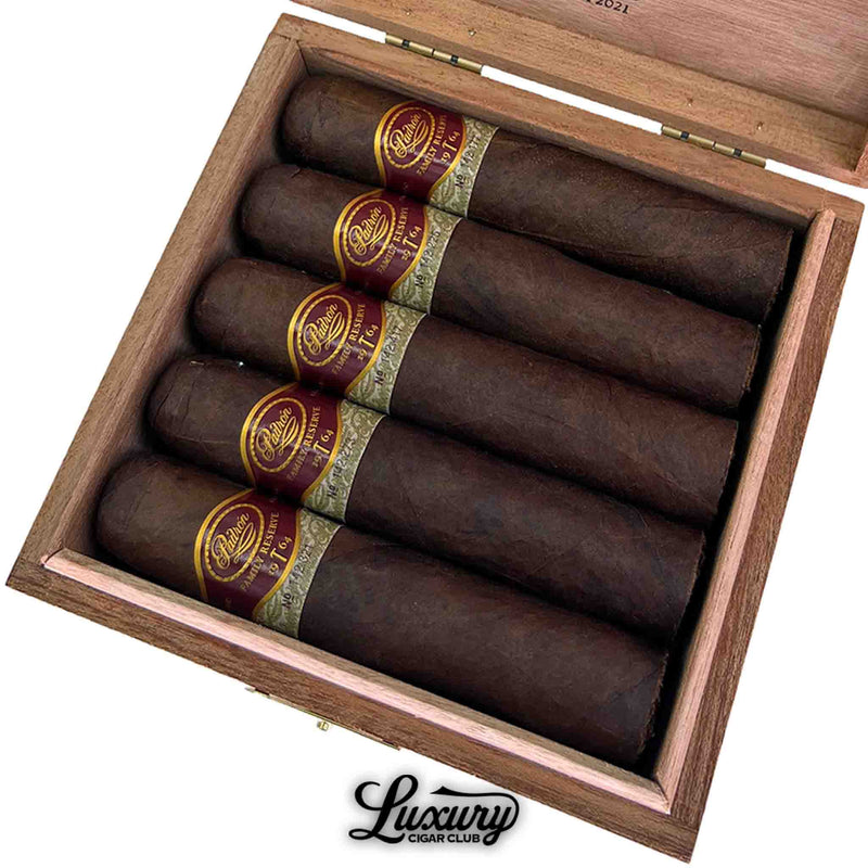 Close-up of Padrón Family Reserve No. 95 Maduro cigars in box, showing dark Maduro wrapper with red and gold bands.