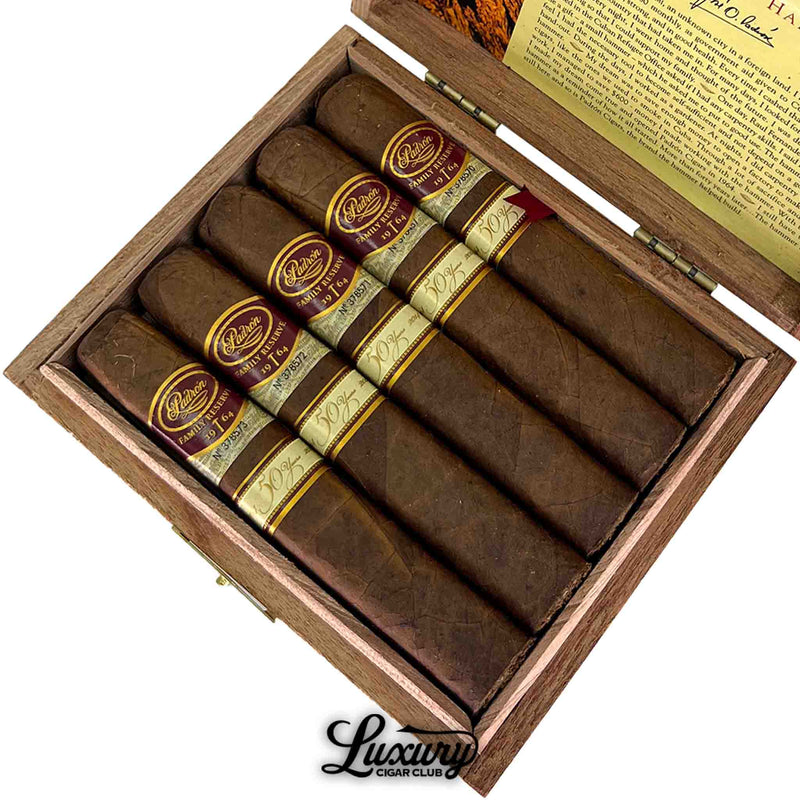 Detailed close-up of Padron Family Reserve Natural No. 50 cigars in a cedar-lined box with branded gold trim from Luxury Cigar Club