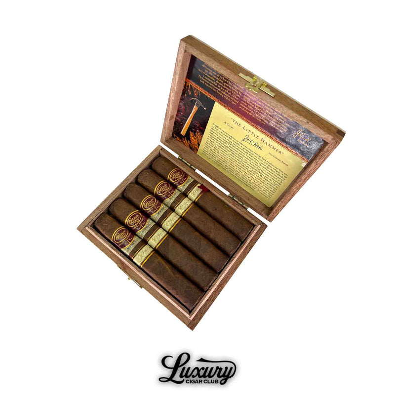 Open box of Padron Family Reserve Natural No. 50 cigars showcasing rich brown wrappers with elegant gold and burgundy bands from Luxury Cigar Club