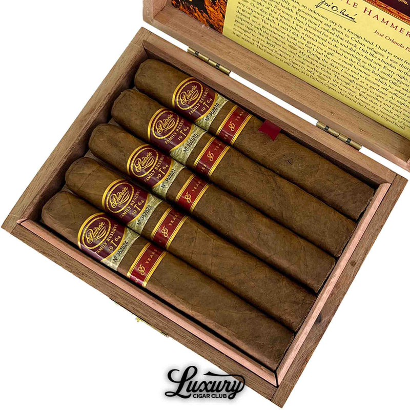 Close-up of Padron Family Reserve Natural No. 85 cigars arranged in a wooden box with rich natural tones available at Luxury Cigar Club