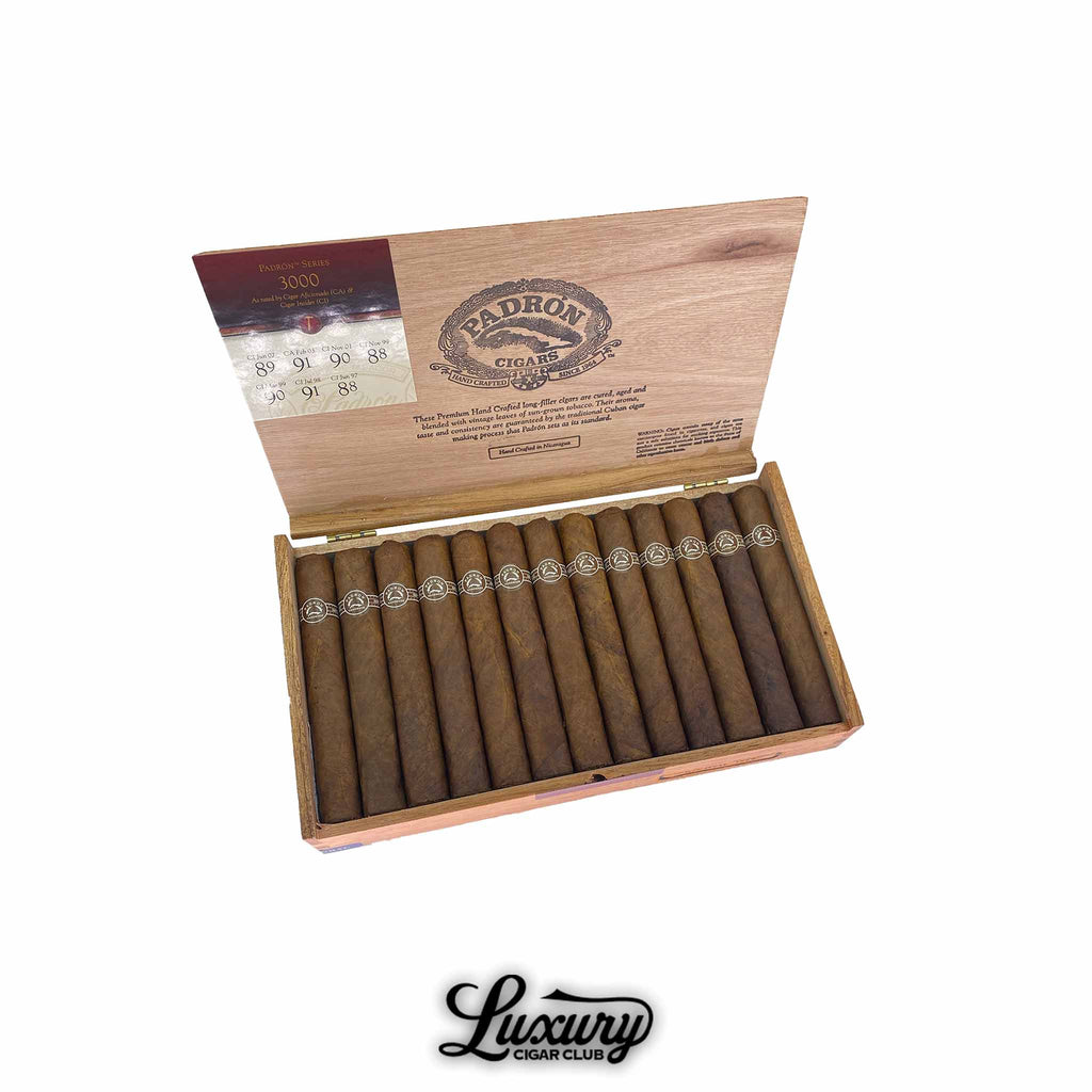 Open wooden box of Padrón Series Natural 3000 cigars, neatly arranged in two rows with brown natural wrappers, detailed cigar bands, and branded inside lid, displayed with Luxury Cigar Club logo.