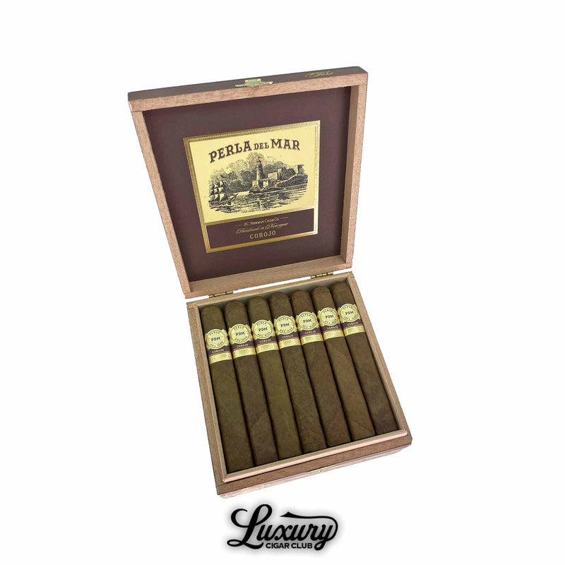 Perla Del Mar Corojo Toro cigars neatly arranged in an open wooden box with vintage style artwork on the lid shown by Luxury Cigar Club