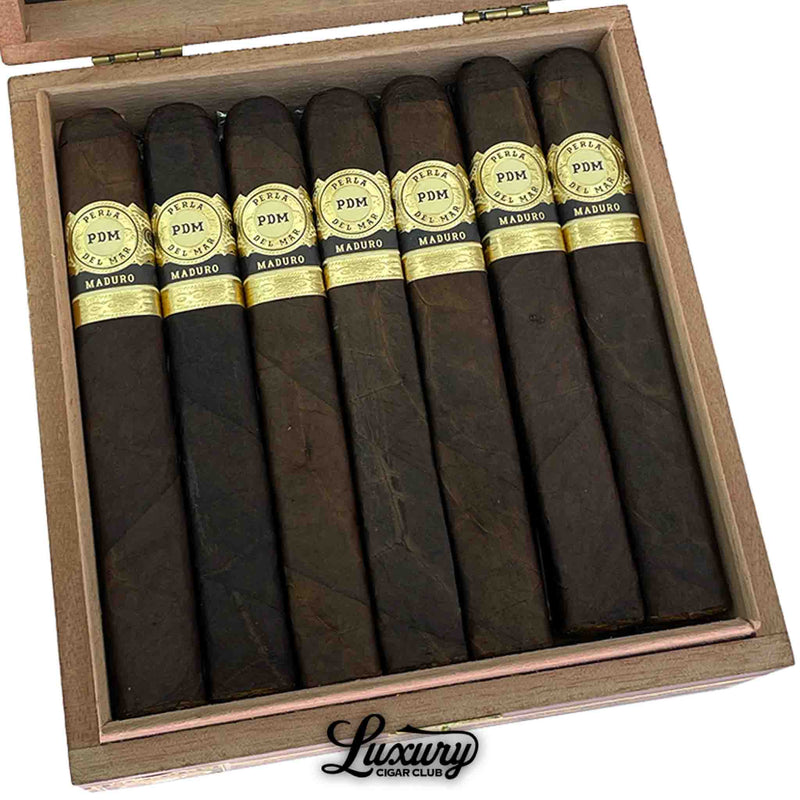 Close up of Perla Del Mar Maduro Toro cigars lined inside the box showing the gold bands and rich dark maduro wrapper for sale at Luxury Cigar Club
